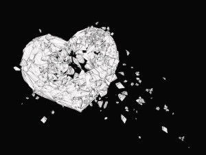 black and white illustration of a heart breaking into pieces