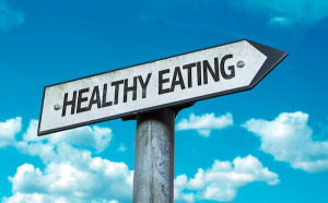 arrow sign with "healthy eating" written on it pointing right